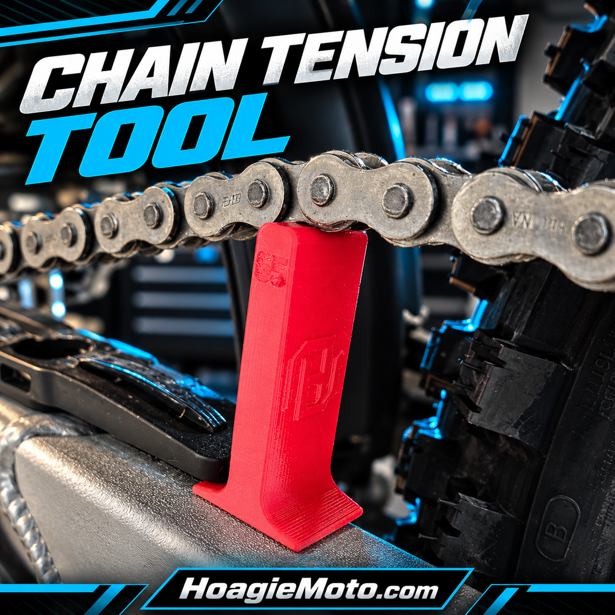 HoagieMoto red chain tension tool installed between a dirt bike chain and chain guard